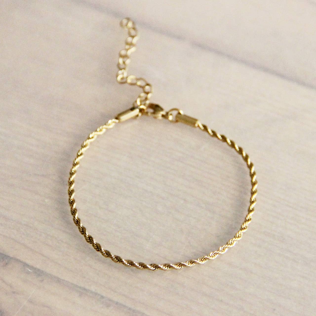 Steel "twisted" bracelet small – gold